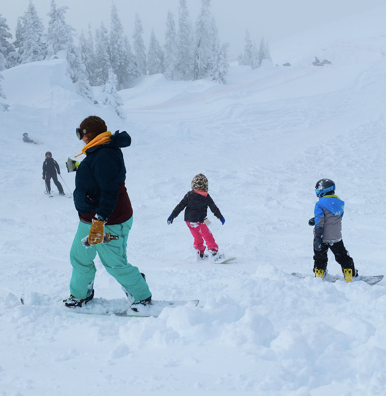 An instructor and young snowboarders during a kids lesson at Hurricane Ridge.